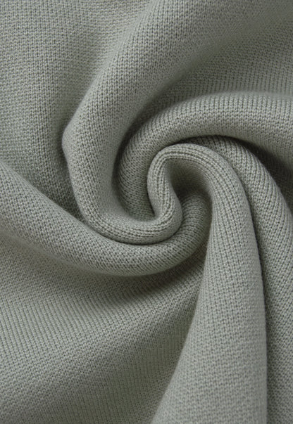 Camisero Nexo Giive verde tejido con cuello camisero, cierre frontal de cremallera y manga larga.