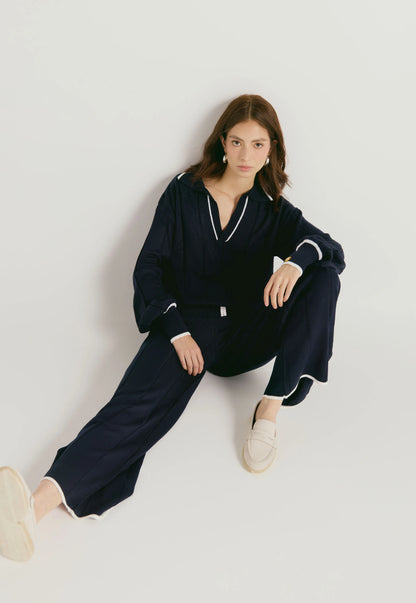 Suéter de tejido suave con cuello en V, manga caída y corte suelto para mujer. y  Pantalón Tiffany de tejido acanalado con bota ancha y cordón de ajuste, para mujer, de corte suelto y juvenil.