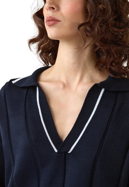 Suéter de tejido suave con cuello en V, manga caída y corte suelto para mujer. 