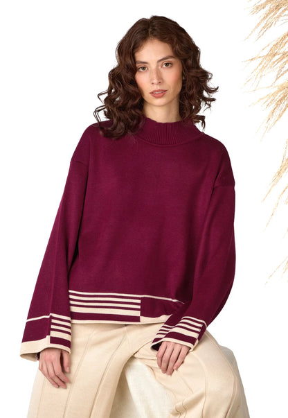 Buzo Amanda de cuello alto para mujer, con corte holgado y tejido Jacquard, detalle lineal en puños y parte inferior.